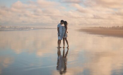 photo of couple standing on water