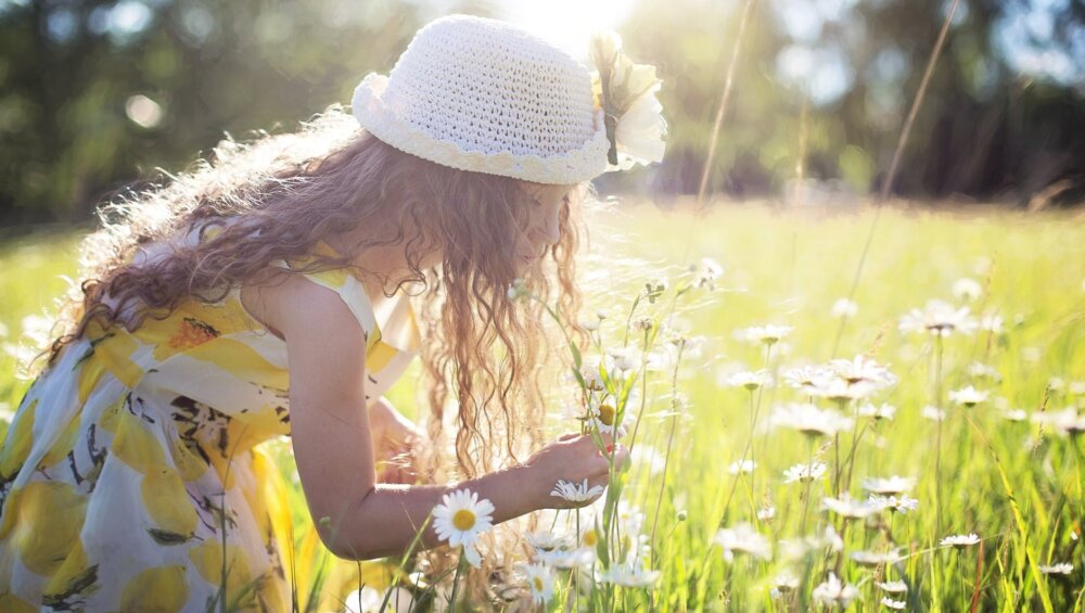 girl picking flowers