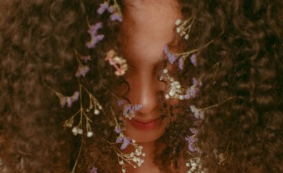 unrecognizable woman with curly hair