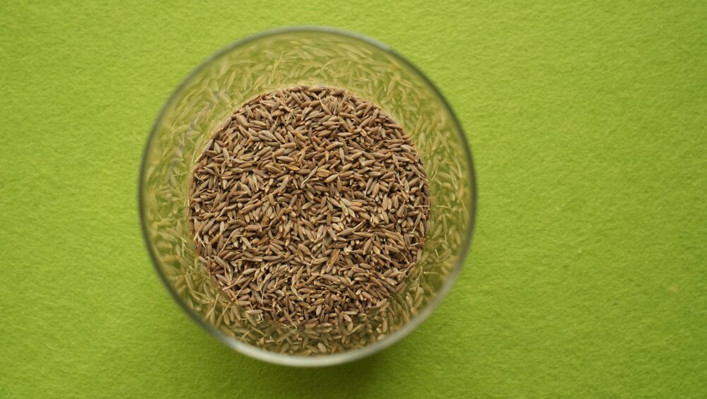 a glass bowl with cumin