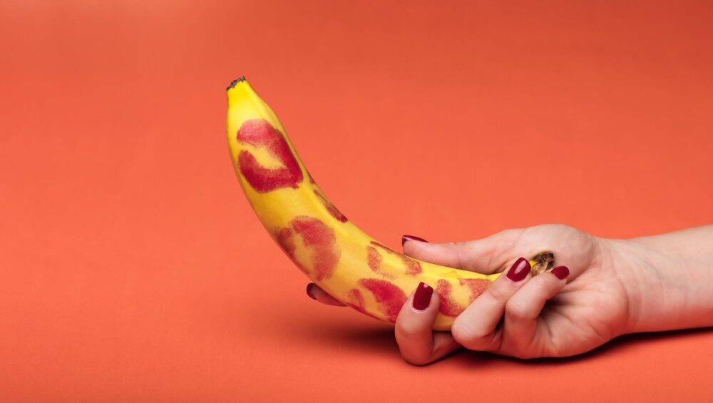 a person holding yellow banana fruit