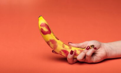 a person holding yellow banana fruit