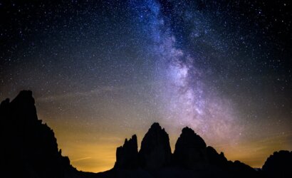 silhouette photography of rocky mountains under starry sky